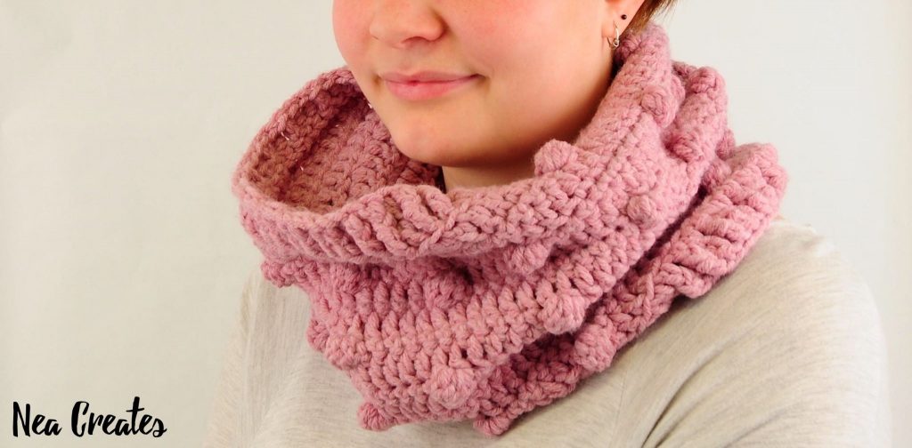 Crochet the super cute and quirky Bobble Stitch Cowl using this easy and FREE crochet pattern! You can crochet the cowl in either of the three sizes available, small, medium or large!