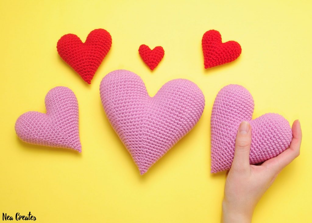 Crochet these super cute amigurumi hearts for Valentine's Day using this FREE crochet pattern! Written pattern with photos for 6 different sizes! | Nea Creates