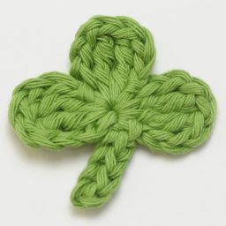 Crochet these super cute Clover Appliqués for Saint Patrick's Day using this quick and easy FREE crochet pattern! #fourleafclover #crochetclover #crochetfourleafclover #freecrochetpattern