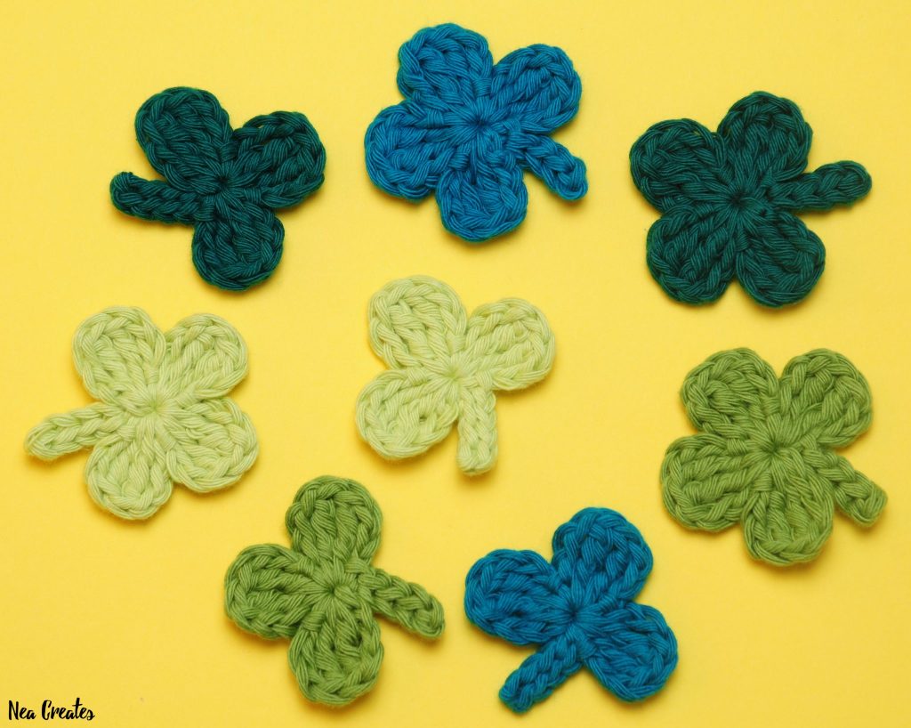 Crochet these super cute Clover Appliqués for Saint Patrick's Day using this quick and easy FREE crochet pattern! #fourleafclover #crochetclover #crochetfourleafclover #freecrochetpattern | Nea Creates